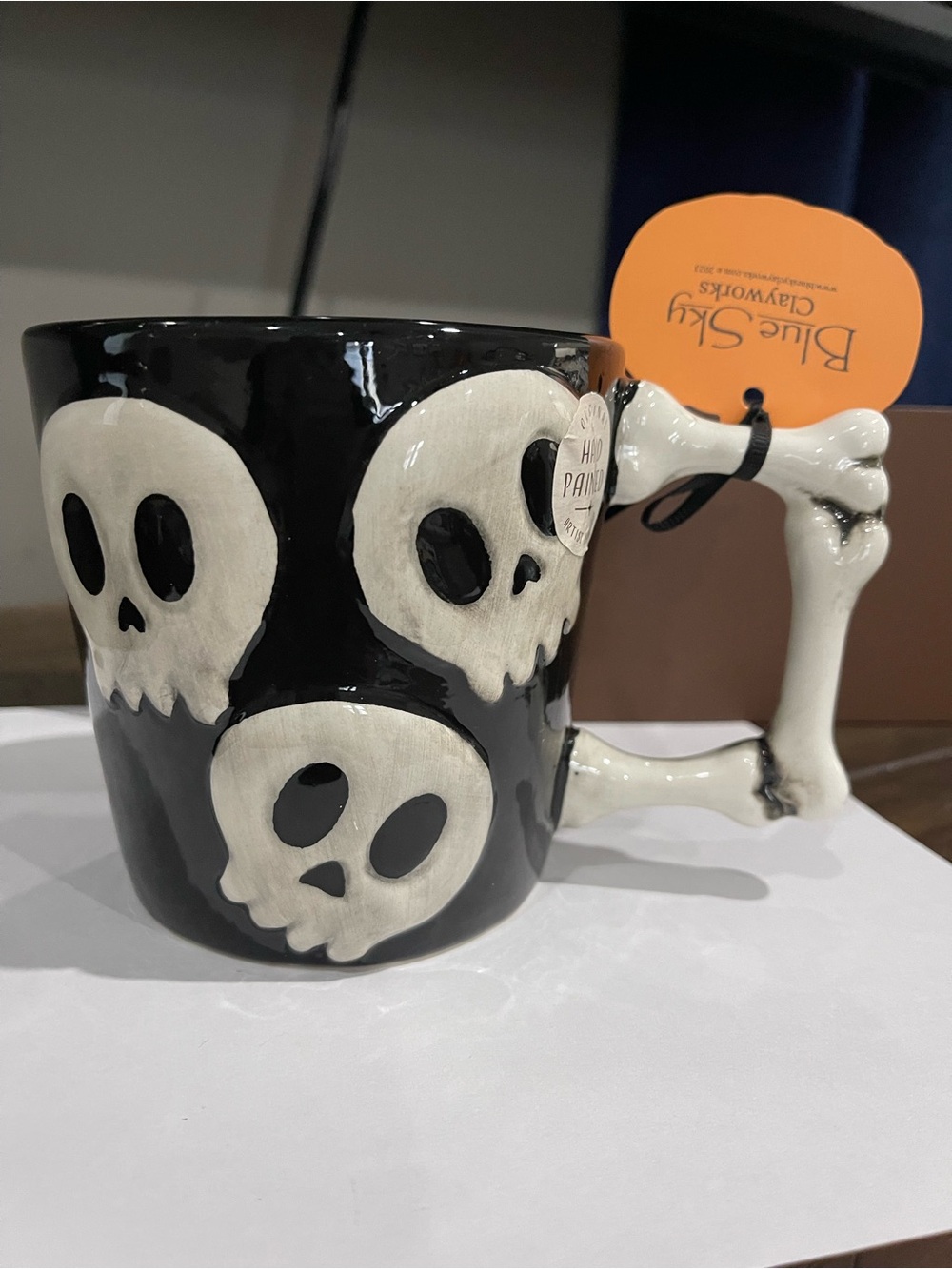Blue Sky Black Ceramic Mug with White Skull & Bone Handle